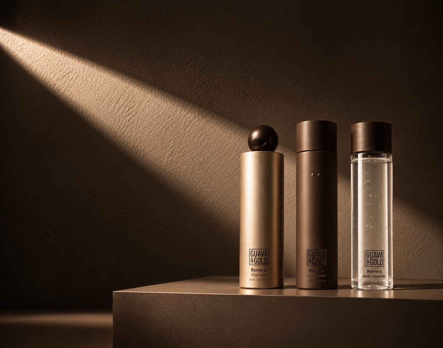 Guava & Gold Romera shampoo, conditioner and clear body cleanser in warm sunlight